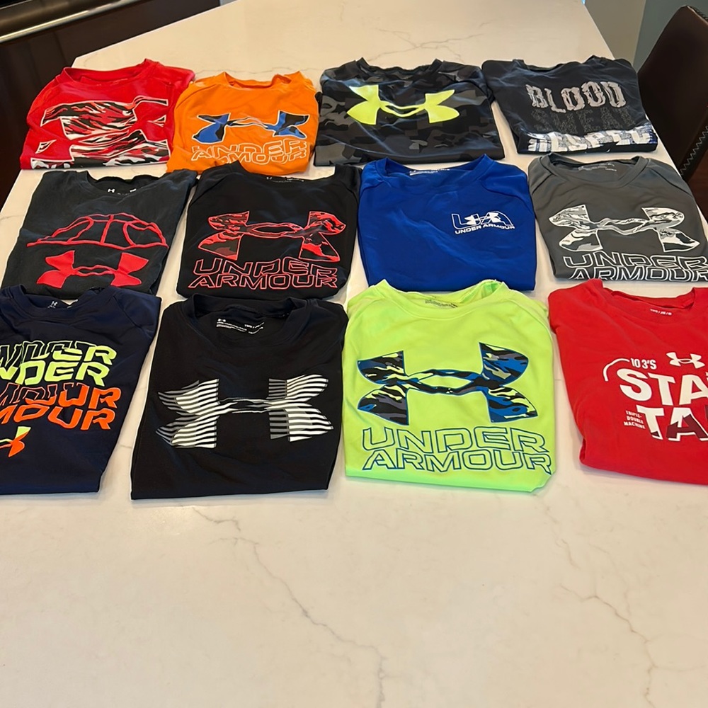 Very good condition Boys Youth Medium Under Armour shirts. All 12 for$80 obo